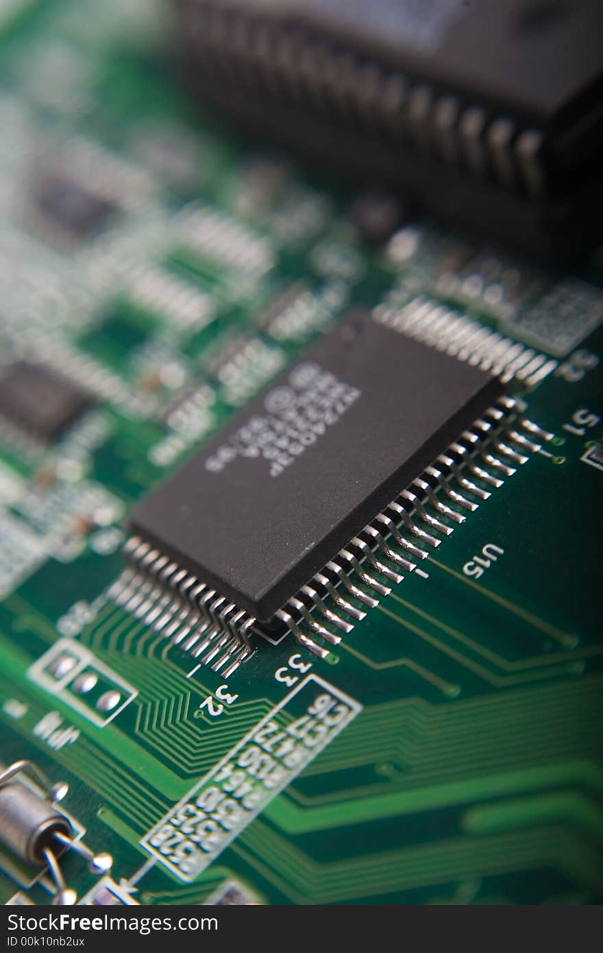 Motherboard's green electronic circuit - macro with shallow depth of field. Motherboard's green electronic circuit - macro with shallow depth of field