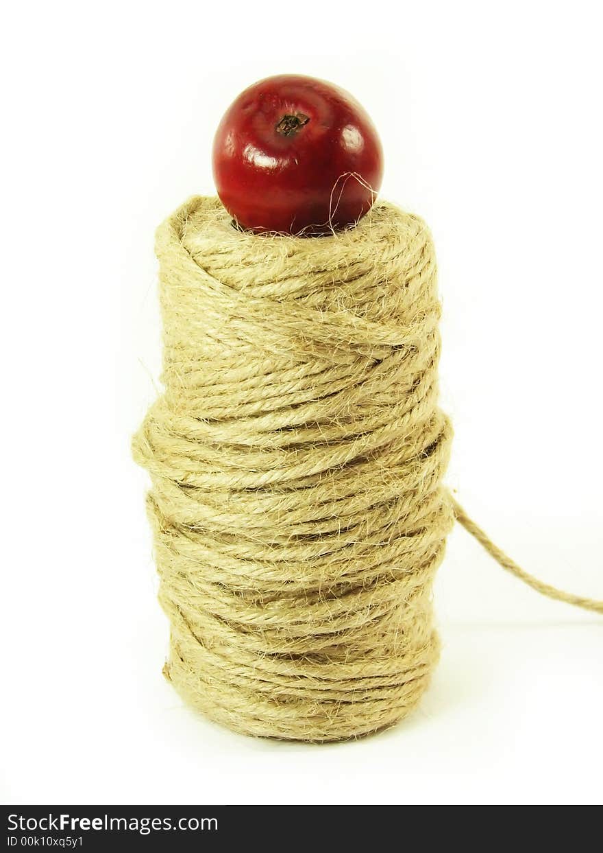 Composite: red apple and string on white background. Composite: red apple and string on white background