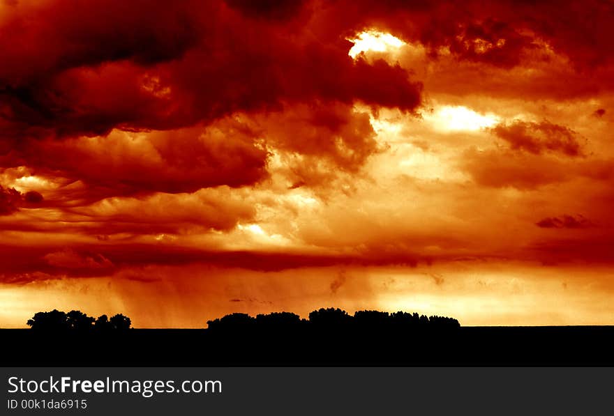 This image was taken just before the rain hit. You can see the rain pouring down on the fields in the lower half of the image. This image was taken just before the rain hit. You can see the rain pouring down on the fields in the lower half of the image.