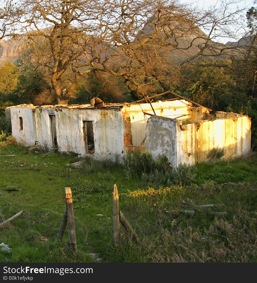 Deserted and derelict farmhouse near Paarl, South Africa in late afternoon sun. Deserted and derelict farmhouse near Paarl, South Africa in late afternoon sun.