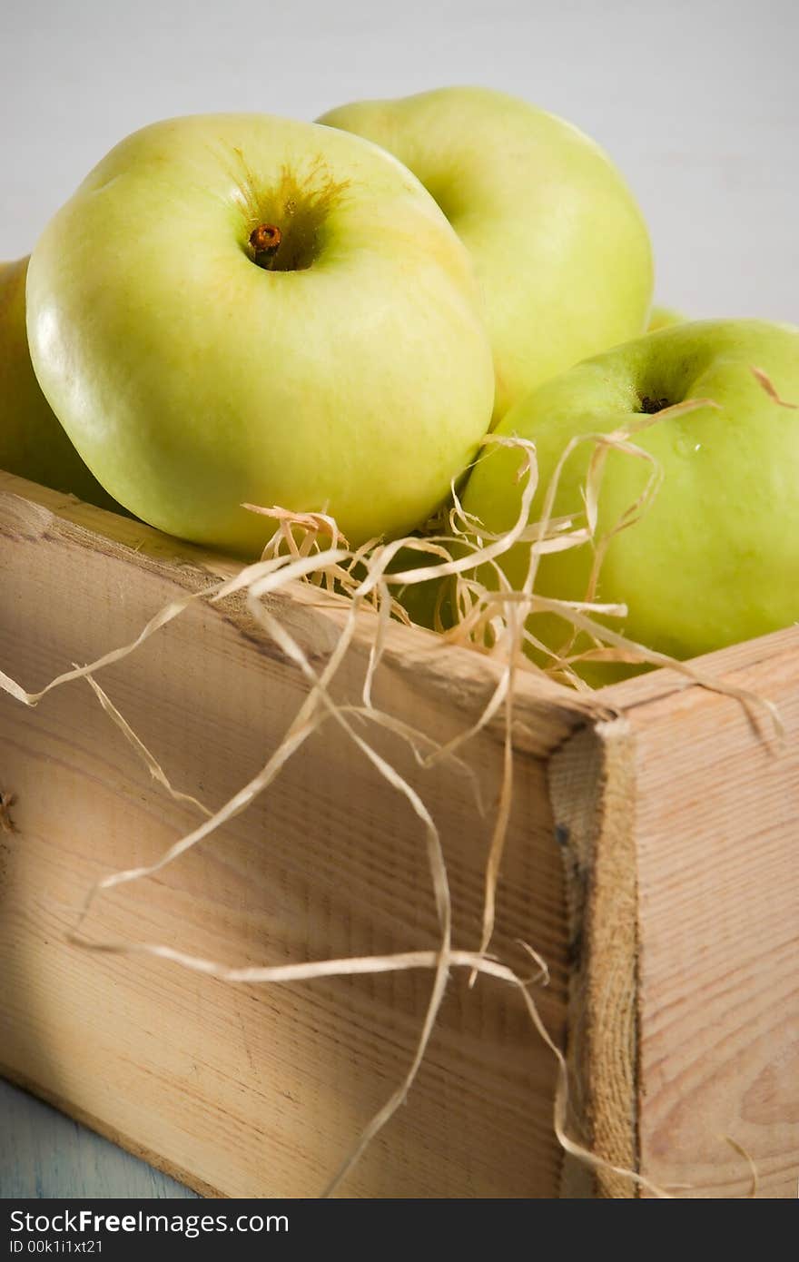 Green apples in the wooden box. Green apples in the wooden box