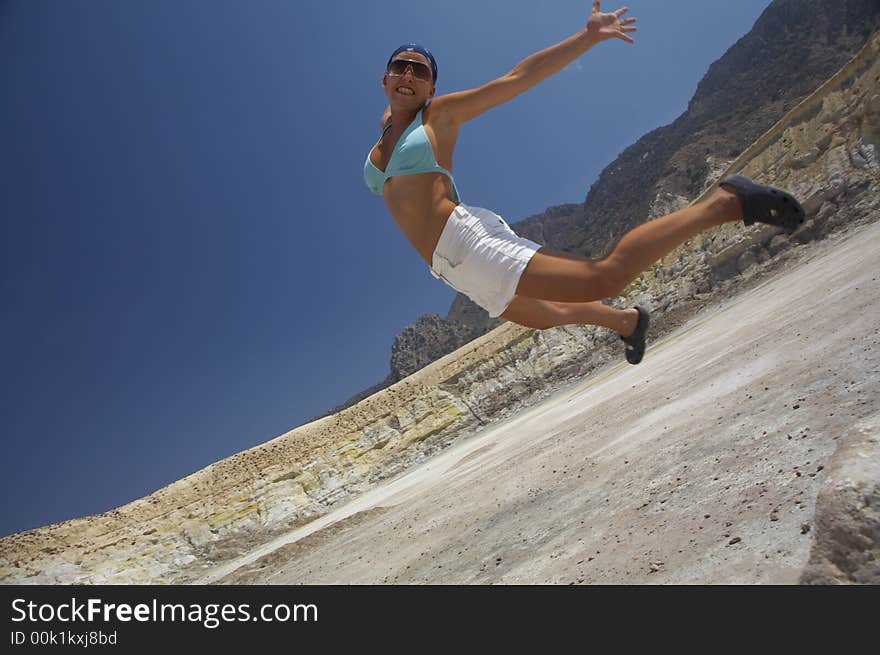 Girl in bikini jumping funny. Girl in bikini jumping funny