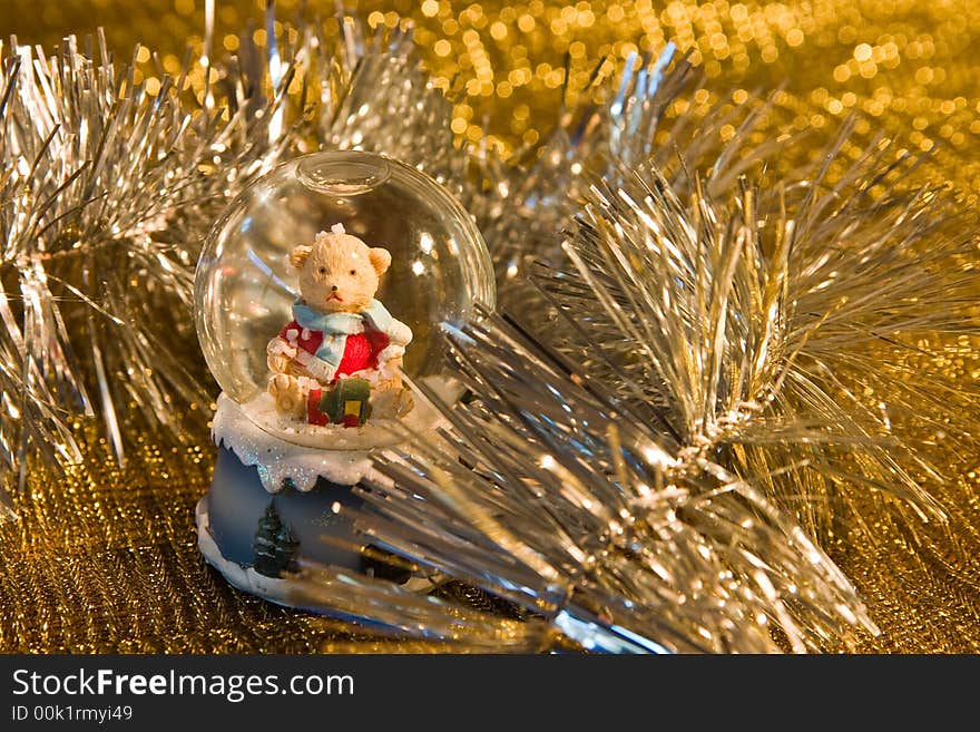 Christmas bear in shiny tinsel