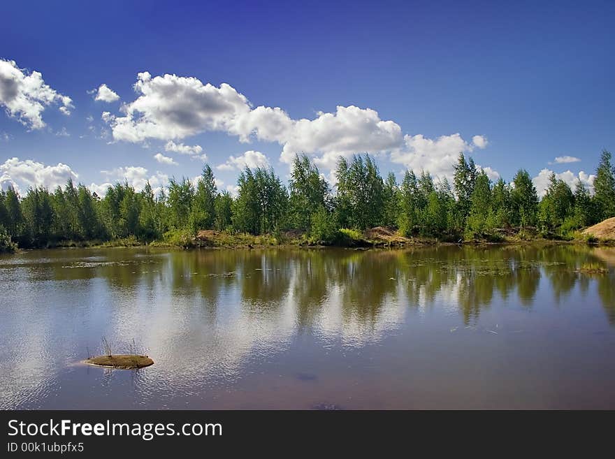 Landscape with blue sky, clouds, forest and lake. Landscape with blue sky, clouds, forest and lake