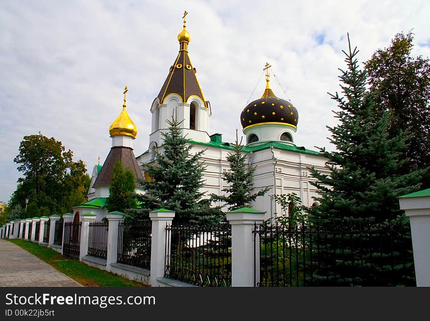 Small church building edged fence with furs