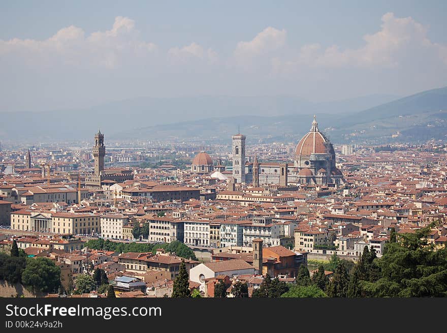 Landscape of Florece from Michelangelo's Square, you can see the Giotto Tower the Brunelleschi's Couple and the Pitti's Palace, in background the fiesole hills. Landscape of Florece from Michelangelo's Square, you can see the Giotto Tower the Brunelleschi's Couple and the Pitti's Palace, in background the fiesole hills