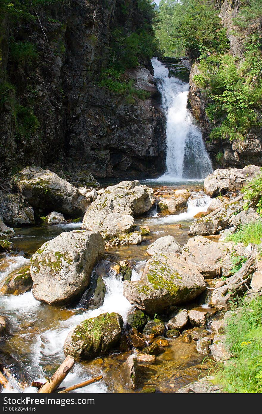 Waterfall grohotun (thunderer) on the same name brook (foothills of Sayan's mountain range)