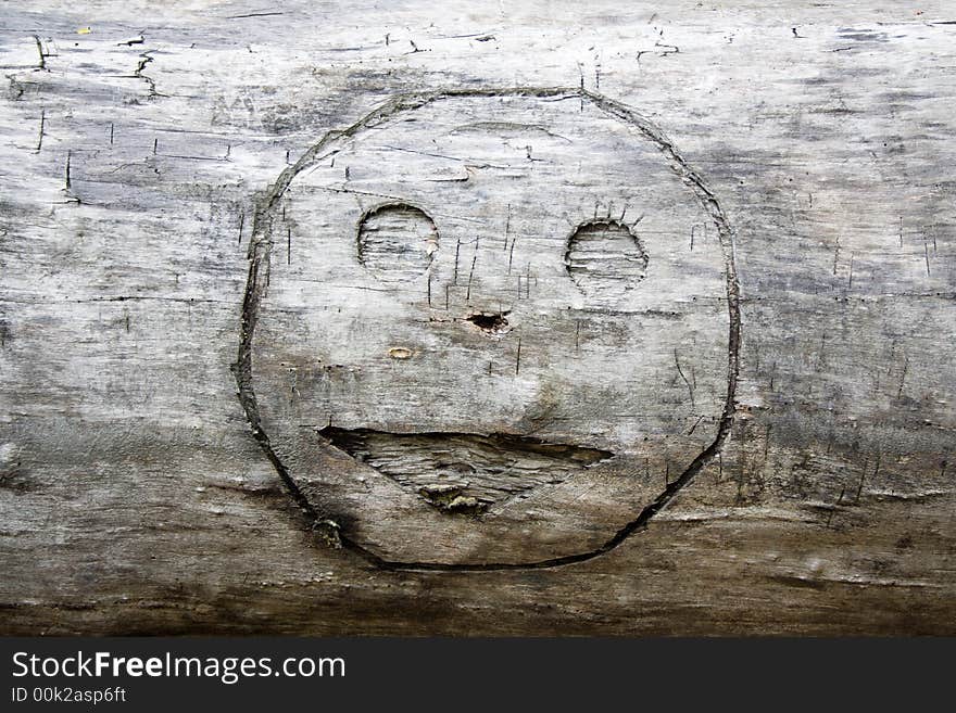 Smile graven in wood