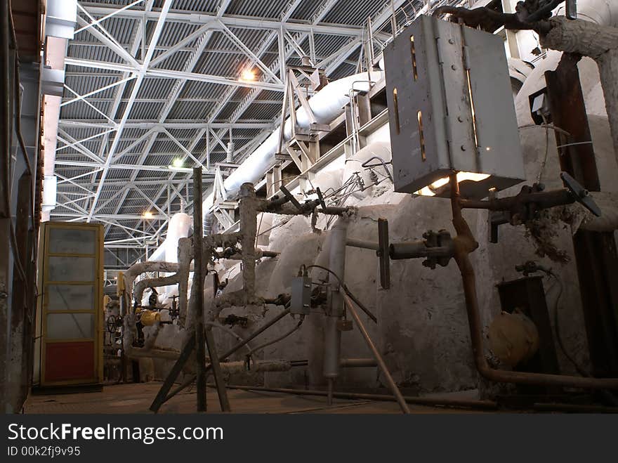 Different types of pipes and tanks inside energy plant. Different types of pipes and tanks inside energy plant