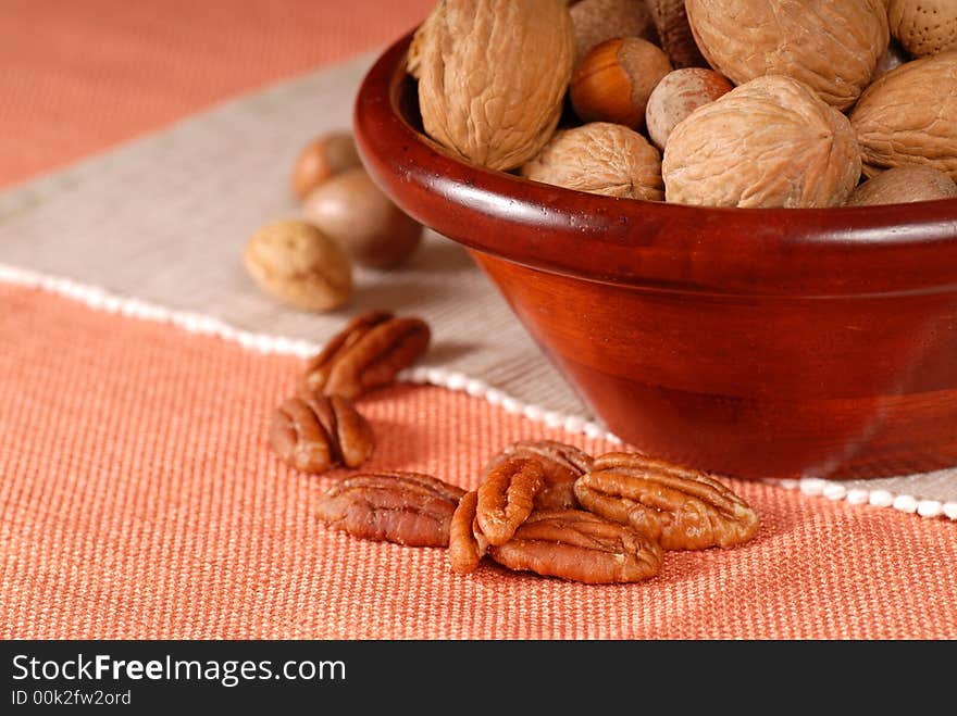 A bowl of mixed nuts in their shells