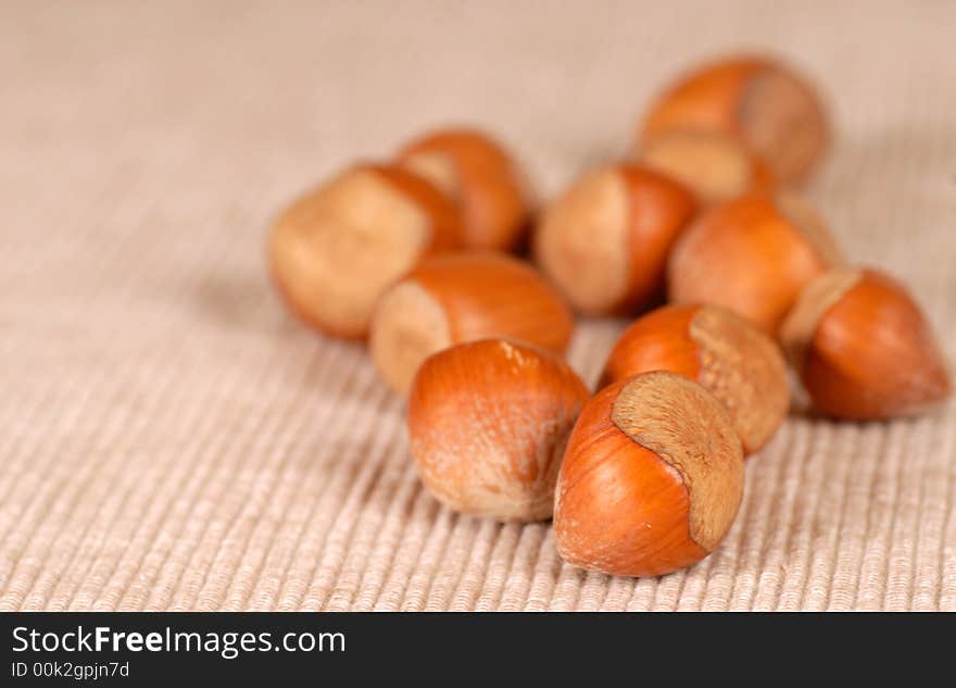 Several fresh whole hazelnuts resting on a table