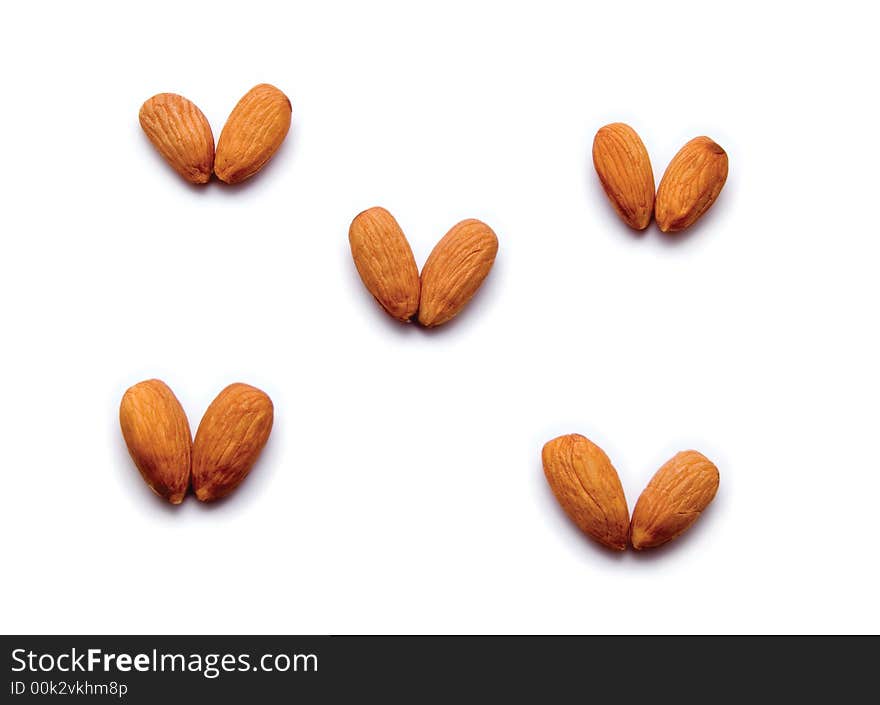 Five hearts from almonds, isolated.
