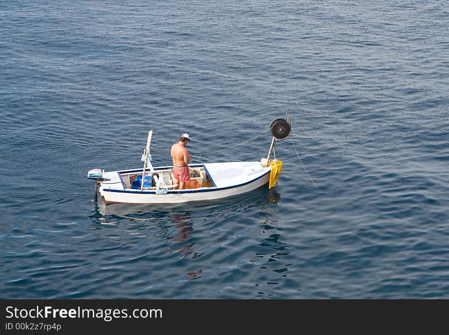 Fishing from an old traditional boat on an old way