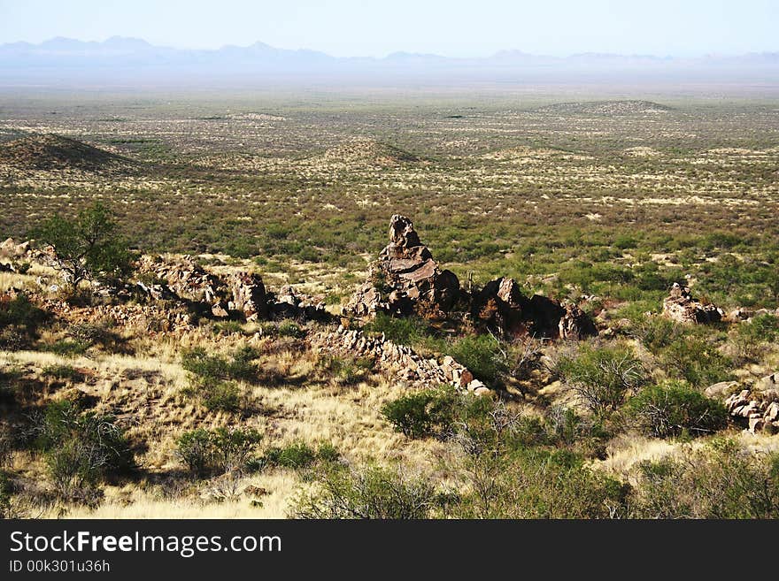 Vast place of desert with rocks and hills.