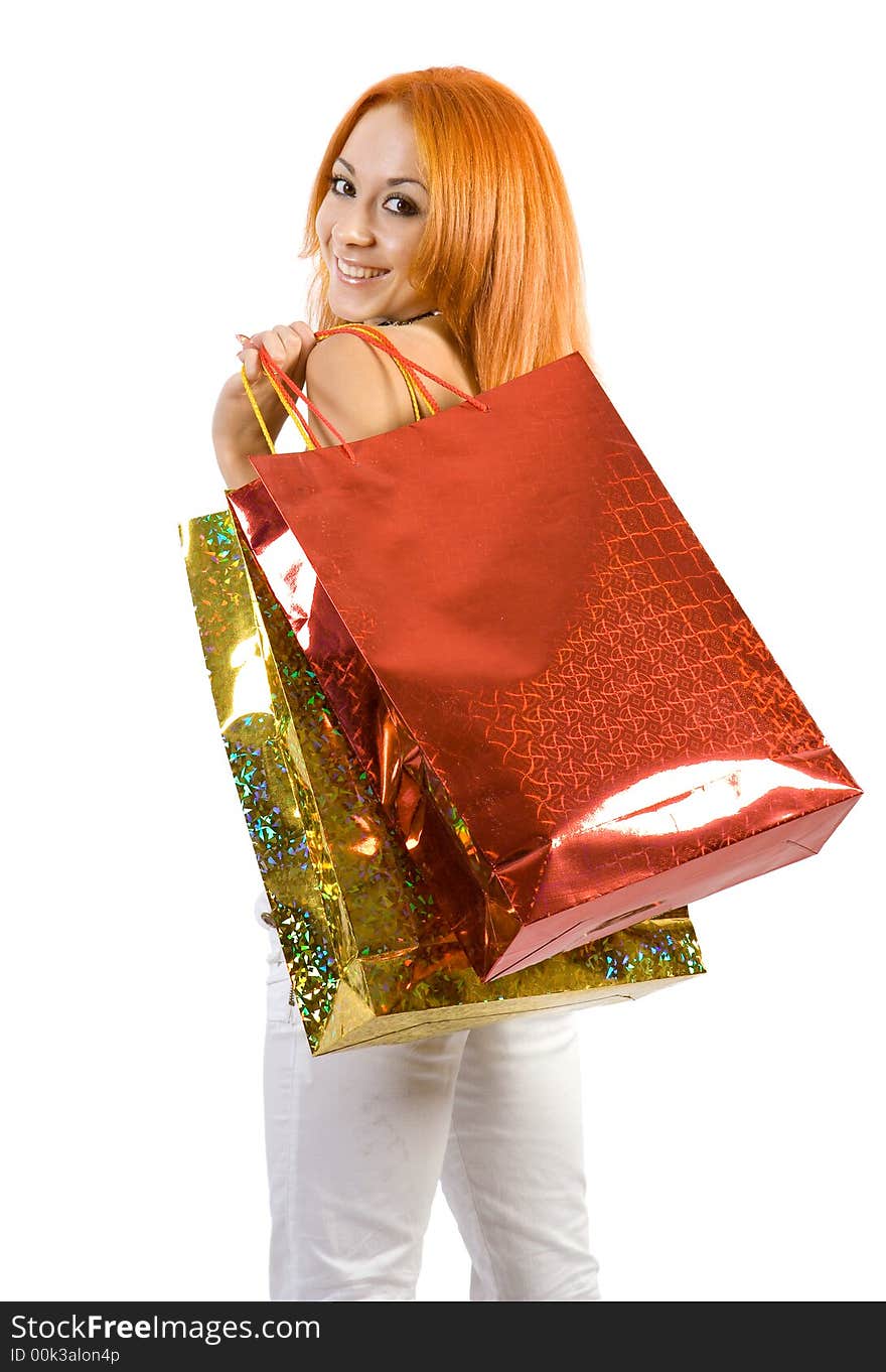 Young girl with shopping bags. Isolate on white background.