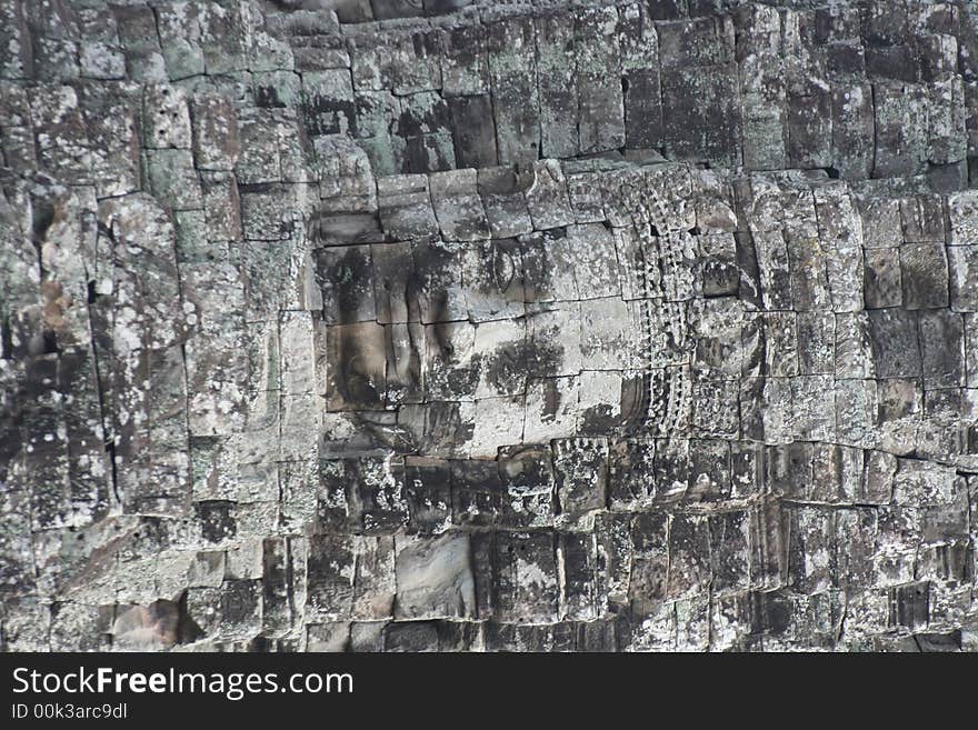 Angkor wat bayan face on temple wall