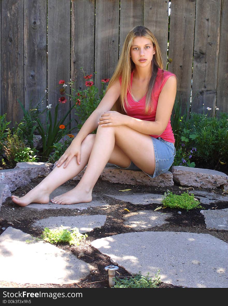 Girl sitting in garden