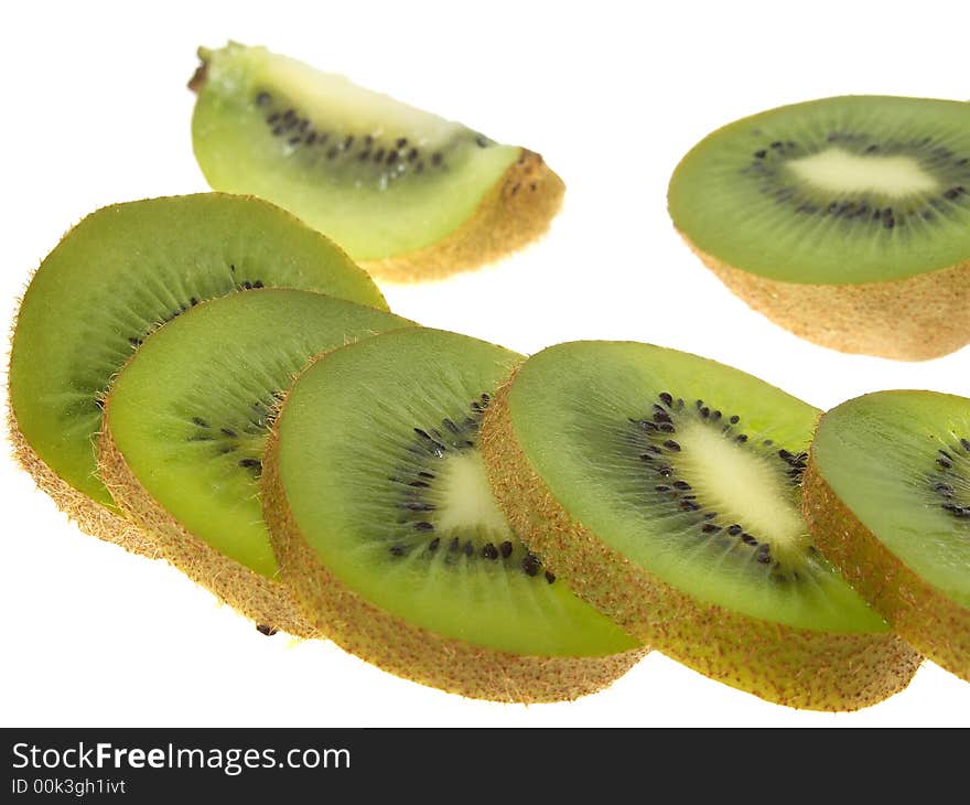 A sliced kiwi fruit, isolated on white. A sliced kiwi fruit, isolated on white