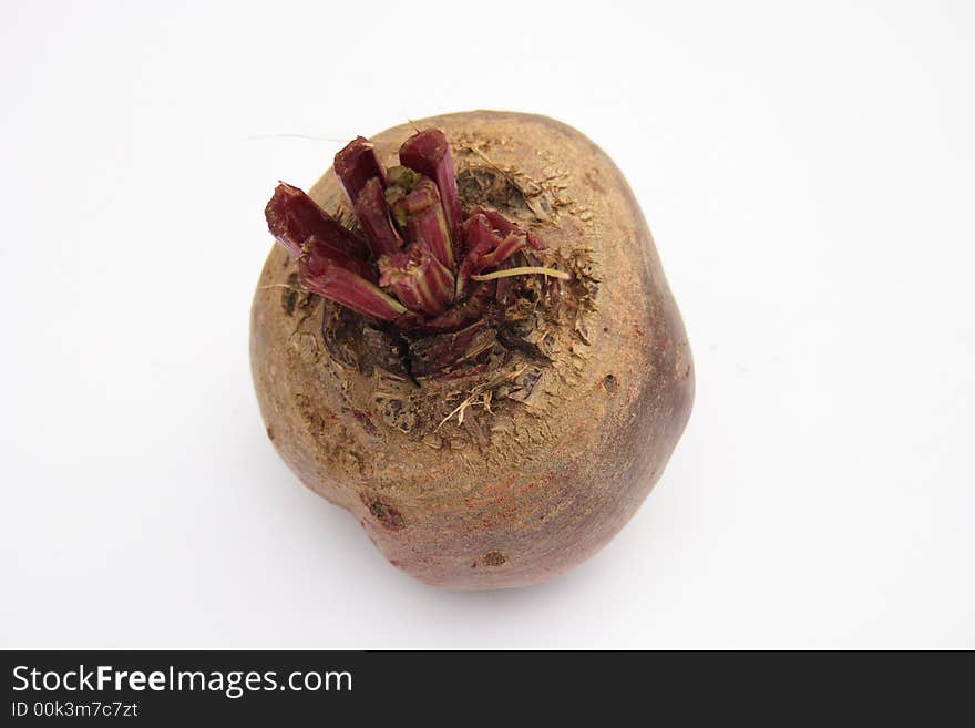 On a photo a red beet. The photo is isolated