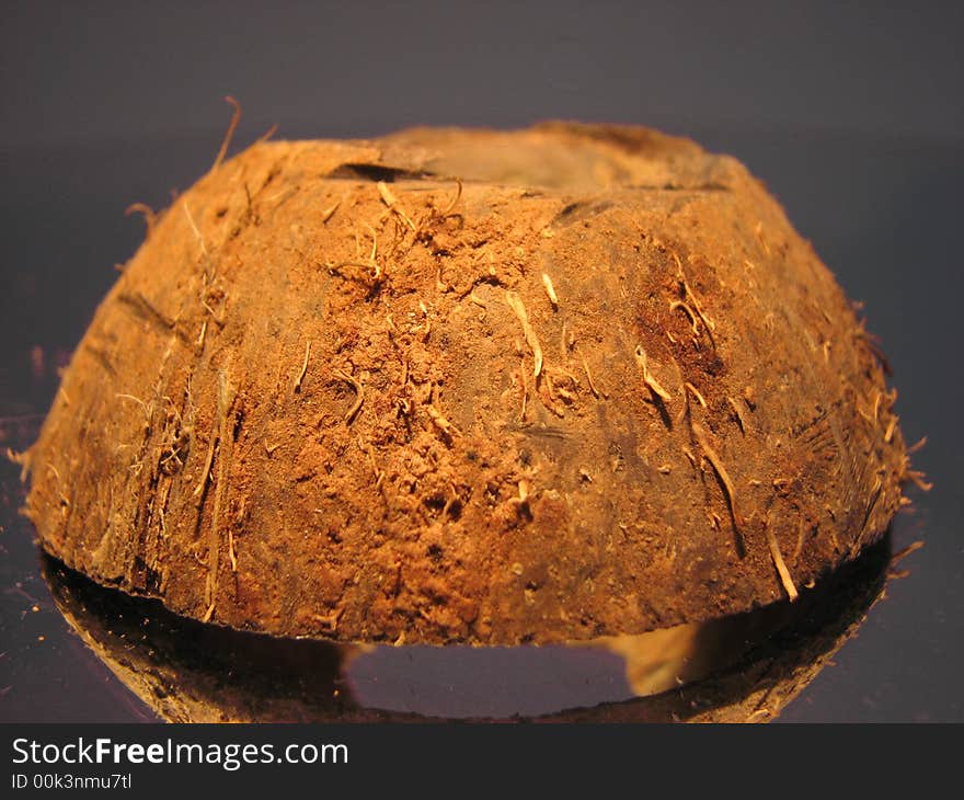 Hairy coconut shell on the grey background. Hairy coconut shell on the grey background.