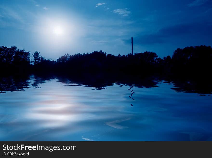 Blue sky with tree silhouette and reflection. Blue sky with tree silhouette and reflection