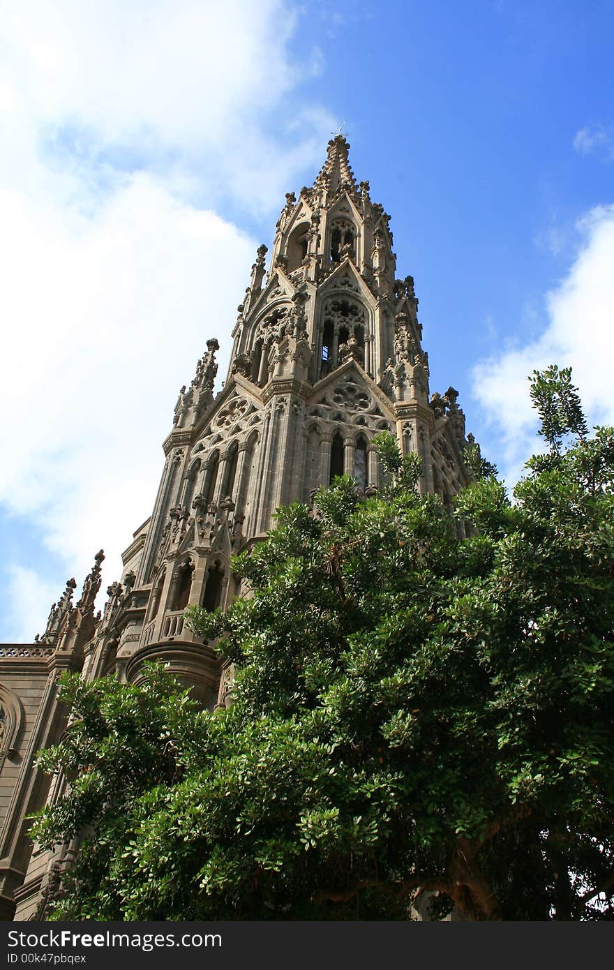 Belfry tower of San Juan cathedral in Arucas, Great Canary, in neogothic style. Belfry tower of San Juan cathedral in Arucas, Great Canary, in neogothic style