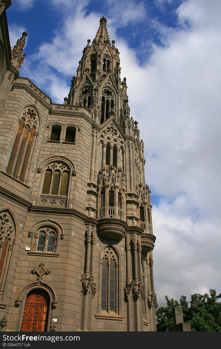 Belfry tower of San Juan cathedral in Arucas, Great Canary, in neogothic style. Belfry tower of San Juan cathedral in Arucas, Great Canary, in neogothic style