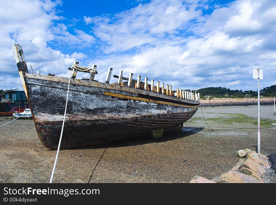 A shipwreck lying in a harbour to be restored