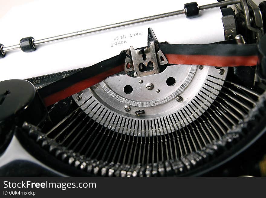 A close up photo of very old typewriter