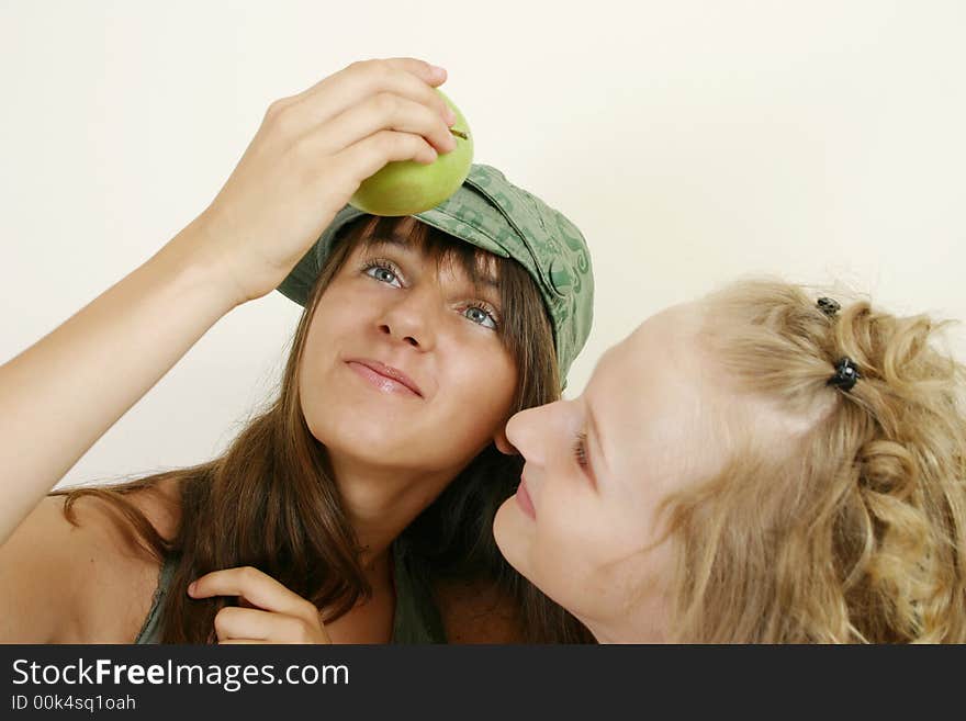 Portrait image of two young girls with apple. Portrait image of two young girls with apple