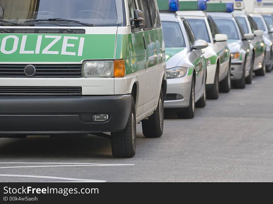 Police vehicles near to a police station. Germany, Munich. Clipping path. Police vehicles near to a police station. Germany, Munich. Clipping path.