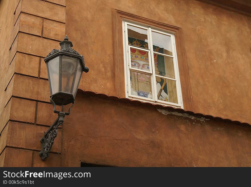 Iron lamp in front of a medieval house at the village of Cesky Krumlov in the Czech Republic. Iron lamp in front of a medieval house at the village of Cesky Krumlov in the Czech Republic.