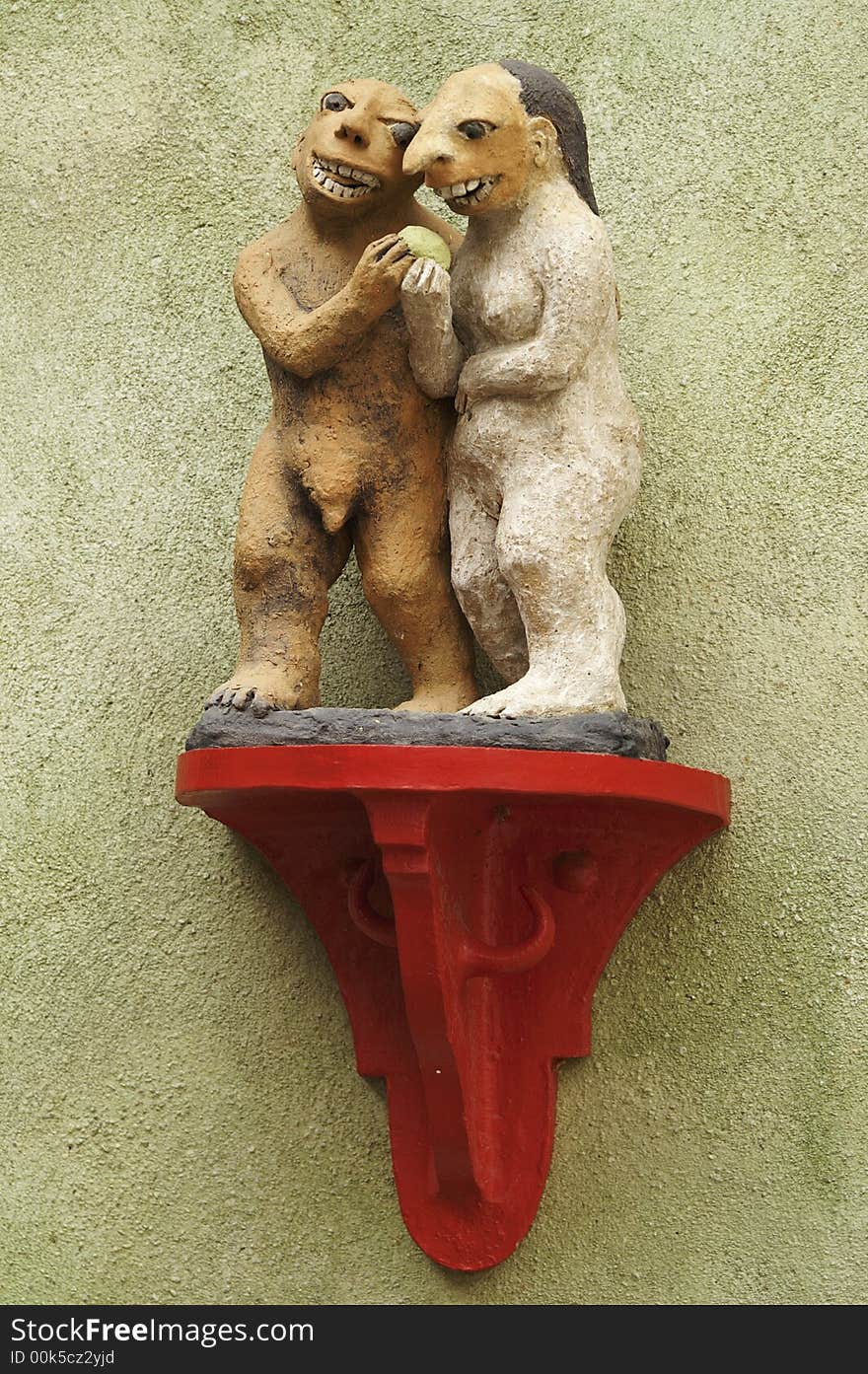 Cesky Krumlov. Adam and Eve, sculptural decoration on the wall at home