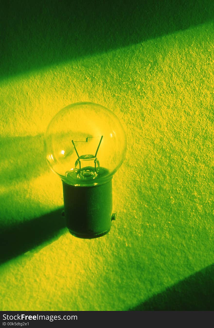 Small bulb on a green background. Small bulb on a green background