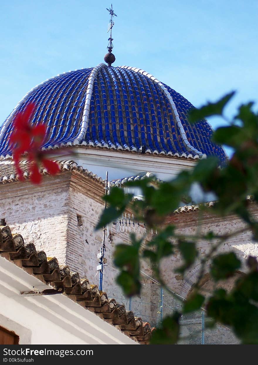 Church dome through foliage