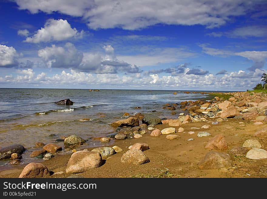 Landscape with blue sky, clouds, stones and sea. Landscape with blue sky, clouds, stones and sea