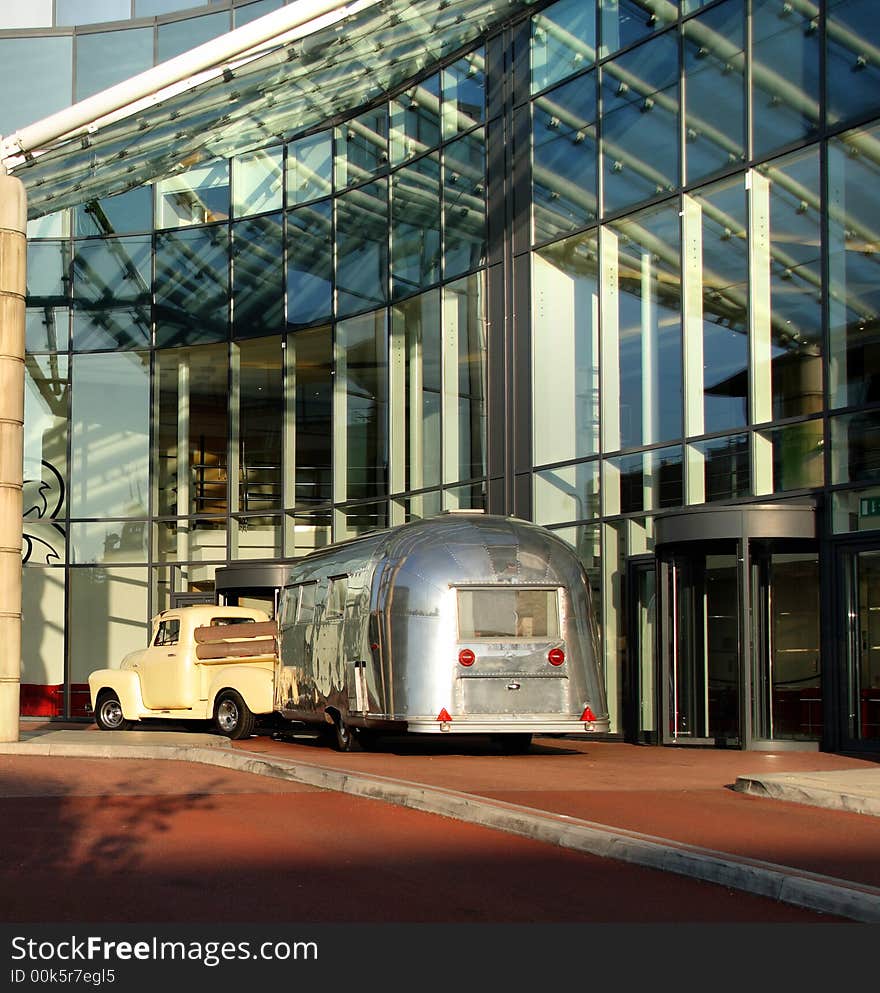 Contemporary Office Building with a Vintage Pickup Truck and Trailer Parked in front. Contemporary Office Building with a Vintage Pickup Truck and Trailer Parked in front