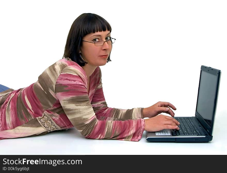 Woman works at computer in relaxed situation. Woman works at computer in relaxed situation