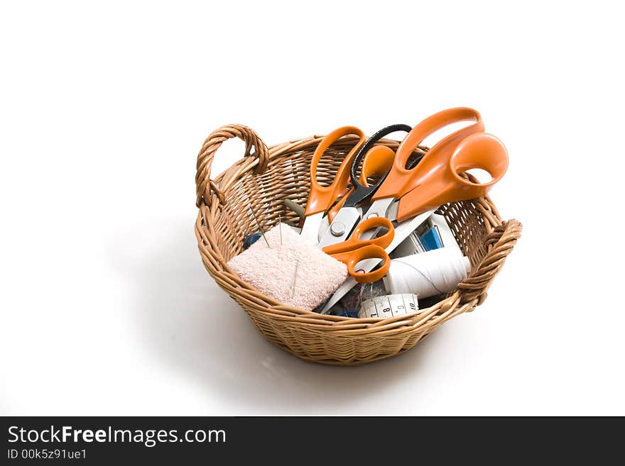 Basket with scissors, pins and threads