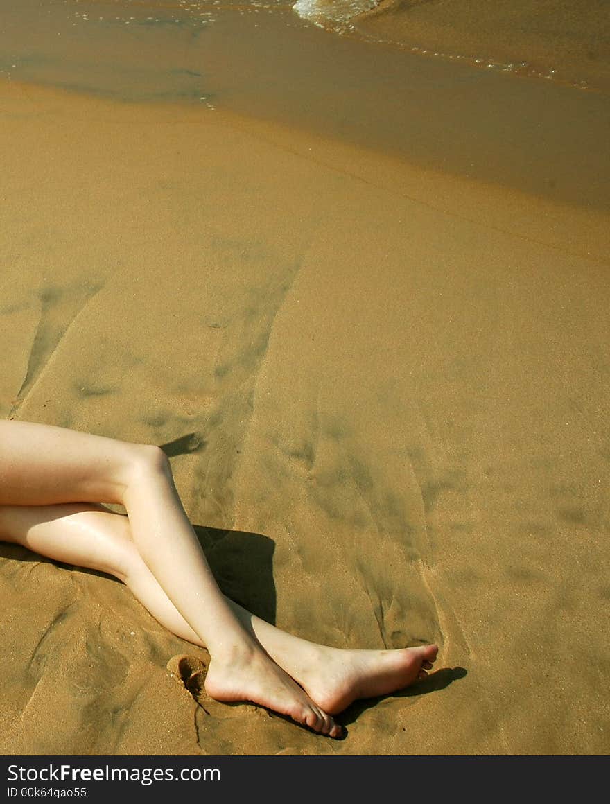 legs on sand