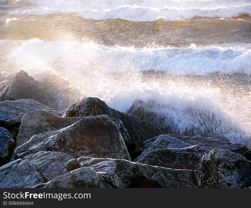 Wild waves crashing on rocks. Wild waves crashing on rocks.