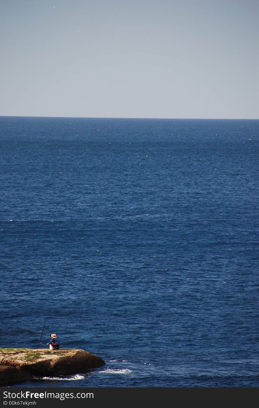 Small Fisherman In Big Ocean