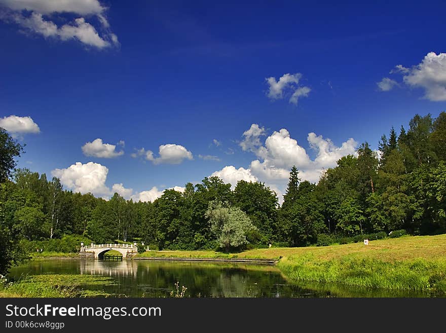 Landscape with blue sky, clouds, forest and lake. Landscape with blue sky, clouds, forest and lake