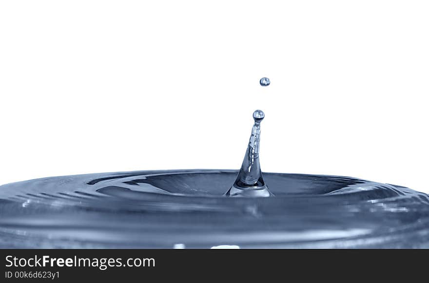 Isolated blue drops are falling down and impact with liquid surface. Isolated blue drops are falling down and impact with liquid surface