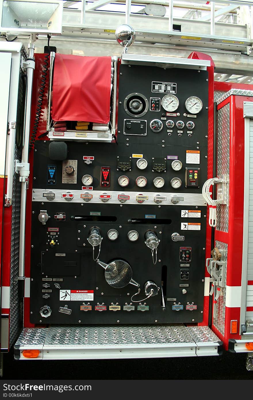 A Fire Truck controls parked outside a firehouse