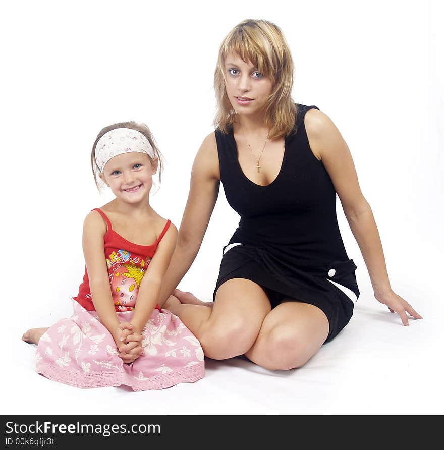 Mother and his young daughter sitting closely. Mother and his young daughter sitting closely