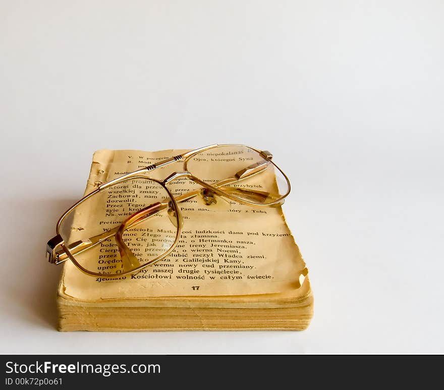 Old prayer book and glasses