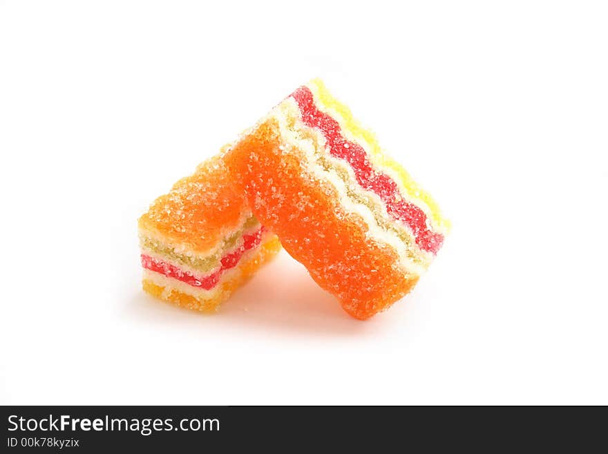 On a photo a piece of multi-coloured fruit candy