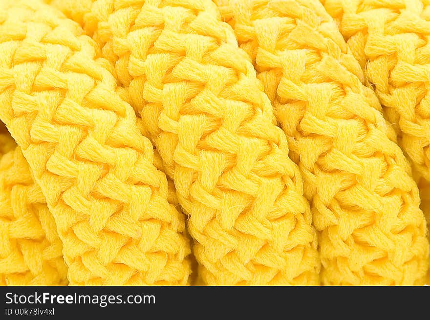 Coils of a yellow cord close up. Coils of a yellow cord close up