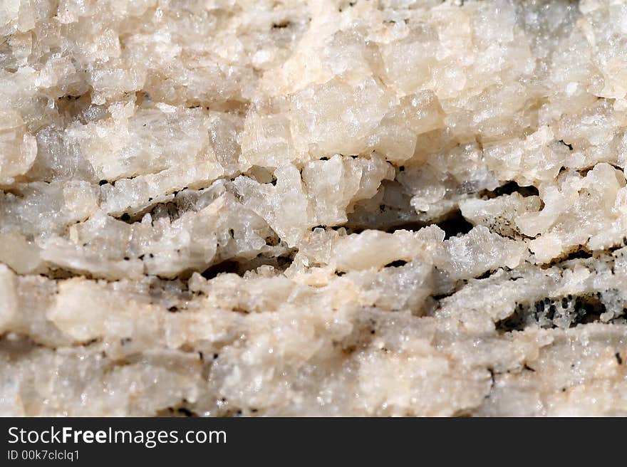 A macro shot of a rock with minerals. A macro shot of a rock with minerals.